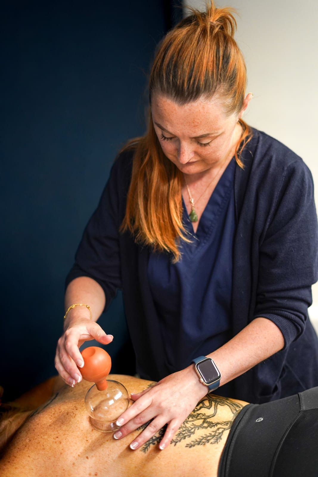 Laura applying cupping therapy at her Boldmere clinic in Sutton Coldfield